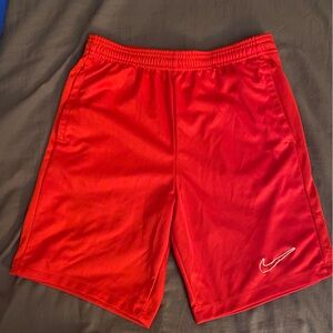 Red Nike shorts